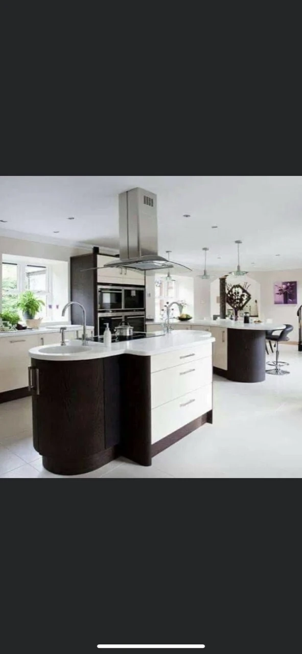 Contemporary kitchen with a tiled floor and contrasting cabinetry